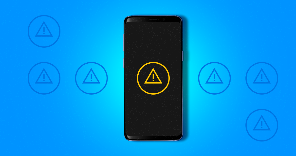 Celular com símbolo de alerta na tela do aparelho